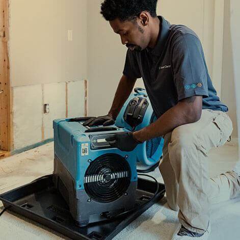 A Green Clean team member working on restoration