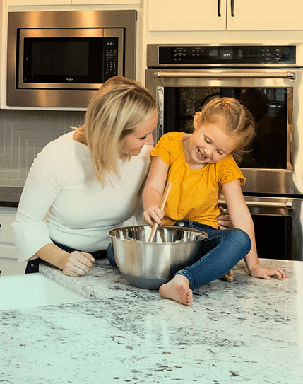 Mother and Daughter cooking together