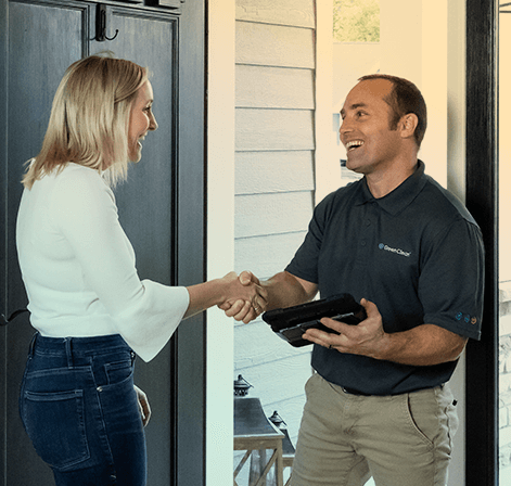 A Green Clean team member shaking hands with a customer