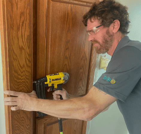 A Green Clean team member working on a home