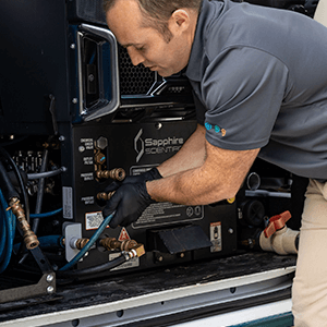 Green Clean team member hooking up equipment